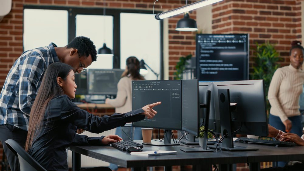 Developers in an office working together to represent LTS long term support software.