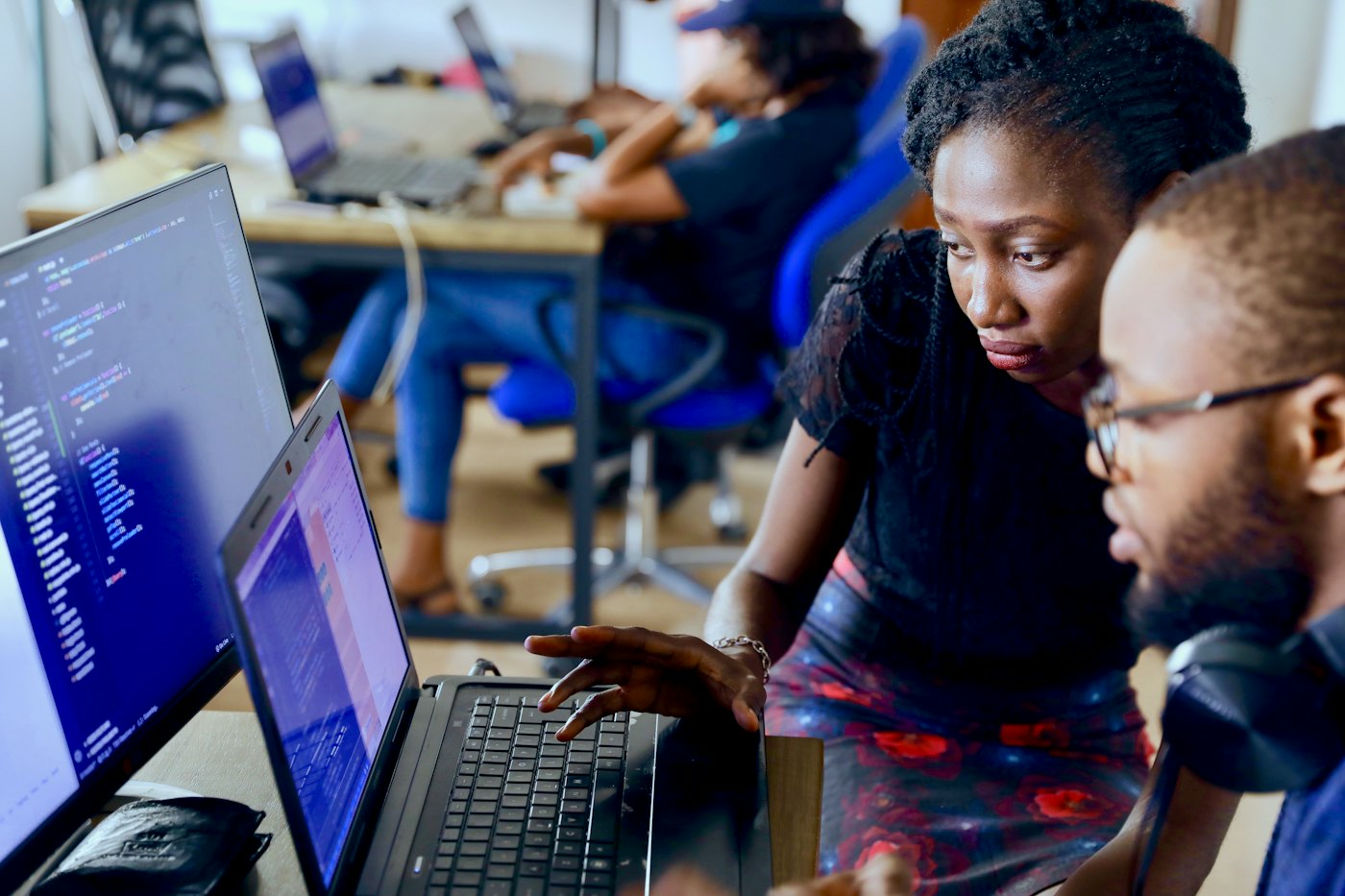 Developers reviewing code together — continuous integration