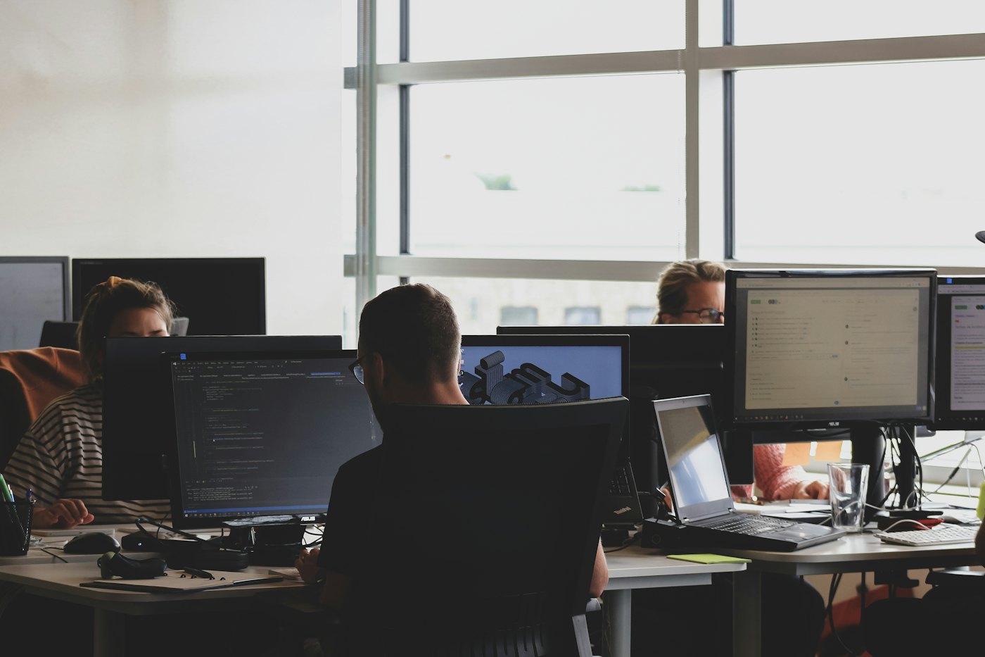 Engineering team working at their screens