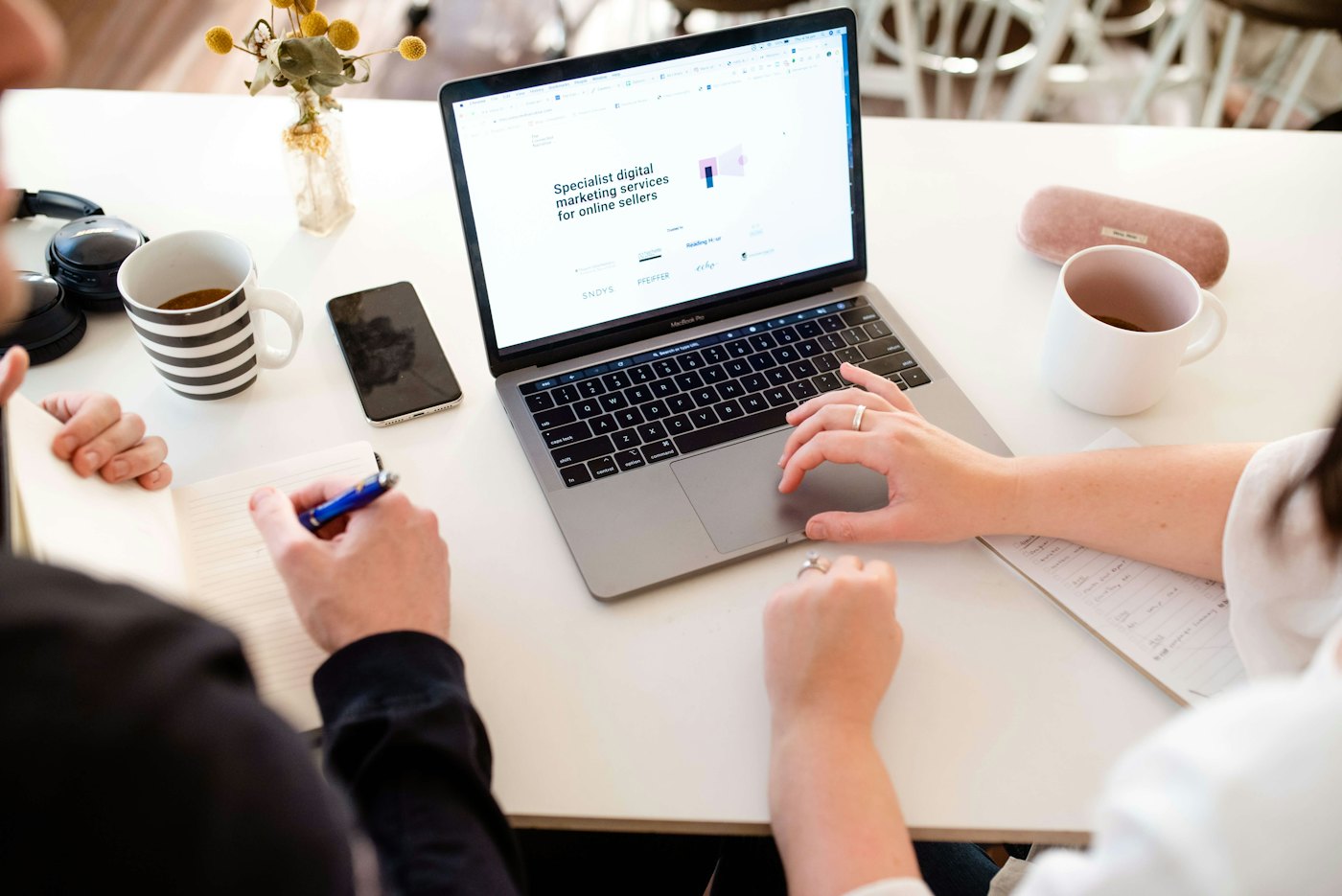 Team planning a WordPress website on a laptop